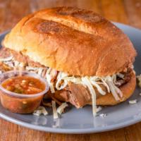 Brisket Torta · Beef. Served with refried beans shredded cheese. Tortas come with pan Blanco Mexican white b...