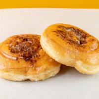 Cinnamon Roll · Swirly, glazed donut with sprinkles of cinnamon powder.