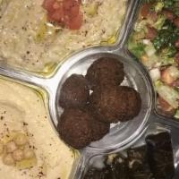 Yafa Mazza Platter · Hummus, baba Ganoush, 4 falafel. 4 grape leaves, Mediterranean salad.