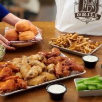 Family Wing Pack · 35 Wings, 2 Large Family Sides, 4 Ranch or Bleu Cheese Dressings and 4 Dinner Rolls