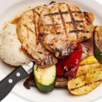 Grilled Maple Pork Chops · Two Bone In Maple Glazed Pork Chops and served with choice of two sides