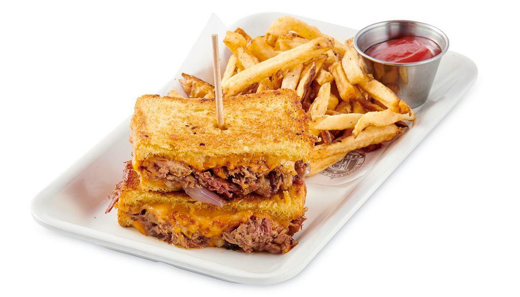 Texan Melt · Smoked Brisket, Honey BBQ Sauce, Sauteed Red Onions with Jack and Cheddar cheese on toasted brioche bread