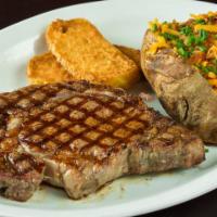 16 Oz. Texas Ribeye · All dinners include your choice of a loaded baked potato, a serving of our fresh-cut fries, ...