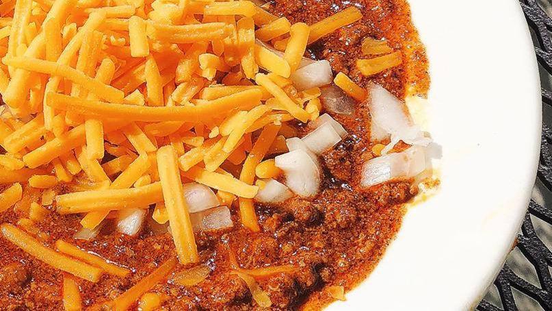 Bowl Of Chili · Topped with cheddar cheese and onions. Gluten free.