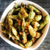 Kickin-Mame · Edamame, seasoned with spices, sauteed in a soy base, and garlic butter.