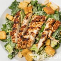 Caesar Salad · Chopped romaine with Caesar dressing, Parmesan cheese and croutons! Also can be made as a wr...