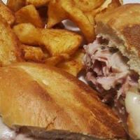 French Dip · Boar's Head roast beef thinly sliced and roasted in au jus. Served on a toasted hoagie roll ...