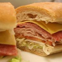 Ham Sub (Hot Or Cold) · Ham, American & provolone cheese, lettuce, tomato, pickle, onion, mayo.