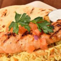 Salmon Plate · Salmon Served with a Side Salad, Tzatziki, and Pita Bread Plus Your Choice of Rice Pilaf, Fr...