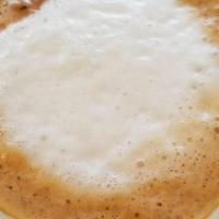 Café Con Leche · Bustelo espresso, steamed milk, and sugar.