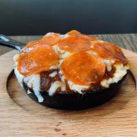 Pepperoni Mac · Fresh basil and garlic, topped with marinara, mozzarella and pepperoni.