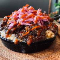 Seoul Mac · Bulgogi and kimchi slaw topped with mozzarella and sriracha sauce