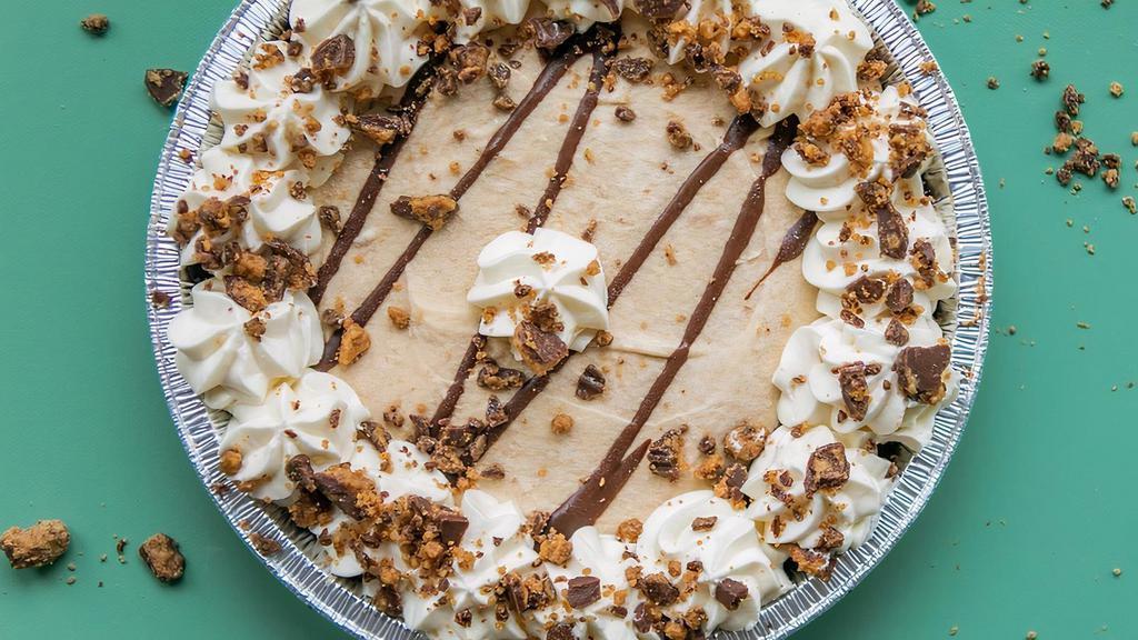 Peanut Butter · in our chocolate crust filled with cream peanut butter filling topped with chocolate ganache, a peanut butter drizzle, our whipped frosting and Reese's crumbles!