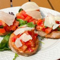 Bruschetta · Toasted bread topped with marinated tomatoes, fresh basil, garlic, drizzled with olive oil a...