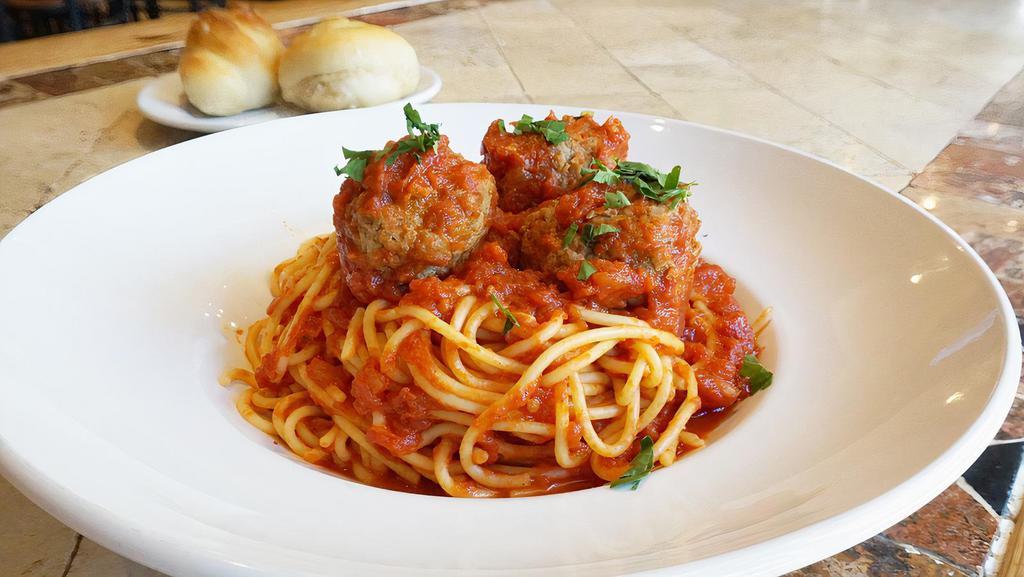 Spaghetti & Meatballs · Spaghetti tossed in our classic marinara sauce, topped with our homemade meatballs.