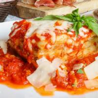 Lasagna Famosa · Meat, ricotta and mozzarella cheese between layers of ribbon pasta smothered in marinara. In...