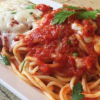 Chicken Parmigiana · Breaded tender chicken topped with mozzarella and marinara sauce with a side of spaghetti ma...