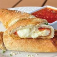 Pepperoni Roll · A delicious blend of pepperoni and mozzarella baked in house-made dough. Marinara sauce on t...
