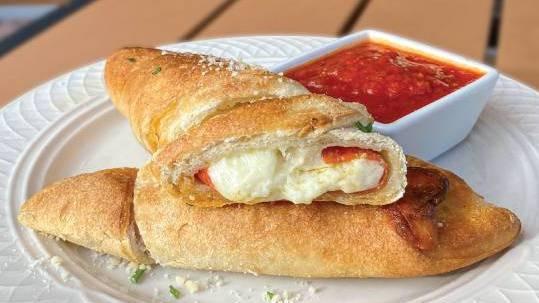 Pepperoni Roll · A delicious blend of pepperoni and mozzarella baked in house-made dough. Marinara sauce on the side. *we're unable to make changes or customize this item*