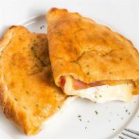 Meat Calzone · Layers of ham, pepperoni, and mozzarella.