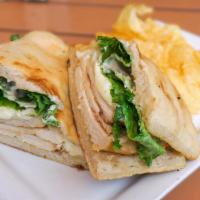 Chicken Caesar Panini · Grilled chicken, romaine lettuce, shredded parmesan, and Caesar dressing in our house-made b...