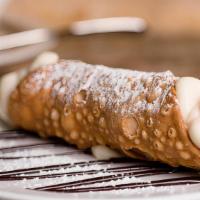 Classic Cannoli · Cannoli filled with sweet ricotta cream and chocolate chips.