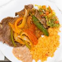 Carne Asada Plate · Skirt steak meat with grilled onions on top. Served with beans, rice and pico de gallo on th...