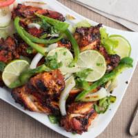 Bbq Wings (6 Pieces) · Marinated spiced chicken wings barbecued to perfection served with fresh lettuce, onion, tom...