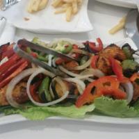 Chicken Tikka Shashlik · Marinated spiced chicken boti with bell peppers, onion, tomato on skewers barbequed perfecti...