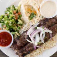 Kofta Kebab · Ground Beef Mixed with Onion, Parsley and spices. Skewers and grilled. Served with Rice and ...