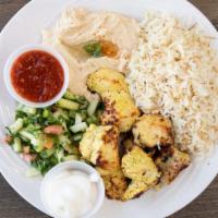 Chicken Kebab · Cubed Chicken breast, marinated skewers and grilled to order. Served with Rice and Salad