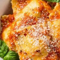 Cheese Ravioli · Ravioli topped with tomato sauce and melted mozzarella cheese