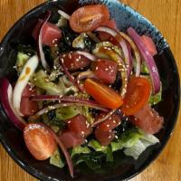 Ahi Tuna Salad · Ahi tuna served with lettuce, red onion, grape tomato, wakame, sesame seeds.