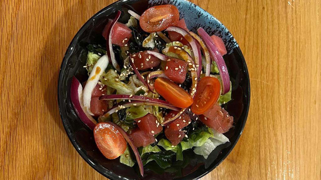 Ahi Tuna Salad · Ahi tuna served with lettuce, red onion, grape tomato, wakame, sesame seeds.