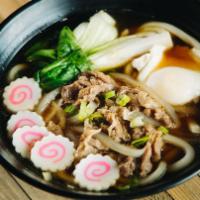 Niku Udon · Udon noodle served with kake broth, sliced beef, sliced white onion, diced green onion, fish...
