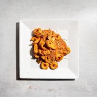 Tortellini Aldiamo · By Amoretto Italian. Tortellini pasta on pink amoretto sauce. Contains gluten, dairy, nights...