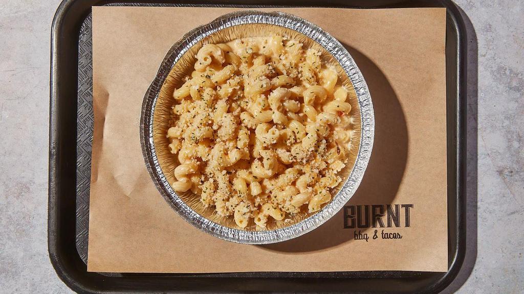 Mac & Cheese · By Burnt BBQ & Tacos. Housemade mac and cheese topped with herbed bread crumbs. Contains gluten and dairy. We cannot make substitutions.