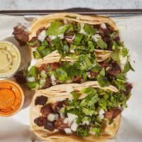 Steak Tacos · By Ale Taco. 3 steak tacos served with onions and cilantro on corn tortilla. Contains gluten...