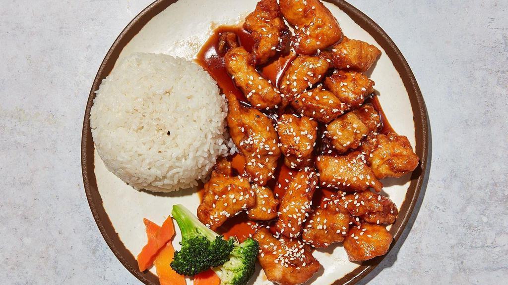Sesame Chicken · By The Chinese Neighbor. Crisp batter with sesame sauce, garlic, toasted sesame seeds, scallions, sesame oil. Served with steamed rice. Contains gluten, sesame,  and soy. We cannot make substitutions.