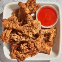Tlc Basket · By TLC Vegan Kitchen. Crispy chicken fried oyster mushrooms with sauce on the side. Contains...