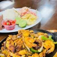 Mixed Fajitas (Fajita Mixta) · Served with refried beans, rice, cabbage salad, cheese, beef and shrimp, tortillas or fried ...