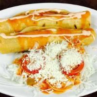 Honduran-Style Tacos (2 Per) (Tacos Hondureños) · Crispy rolled corn tortilla with chicken, cabbage salad, cheese, and home-made salsa.
Tacos ...
