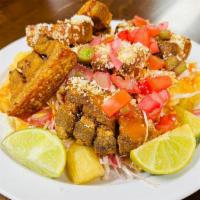 Yuca With Pork Rinds (Yuca Con Chicharron) · Served with cabbage salad and home-made salsa.
Servido con ensalada de repollo y salsa.