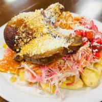 Pork Chops With Fried Banana Slices (Chuleta A La Ceibeña) · 8 oz. pork chop served with fried banana slices, cabbage salad, and home-made salsa.
Chuleta...