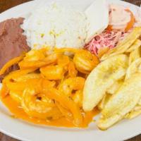 Stewed Shrimp (Camarones Guisados) · Served with rice, refried beans, cheese, cabbage salad, choice of fried banana slices or tor...