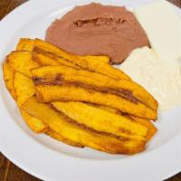 Sweet Plantain (Plátano Maduro) · Sweet plantain served with refried beans, sour cream, and cheese.