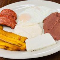 Typical Honduran Breakfast (Desayuno Típico) · Served with refried beans, sour cream, cheese, your choice of eggs, sausage, sweet plantain,...