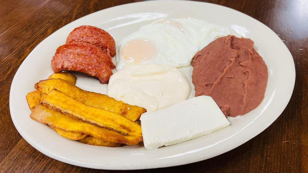 Typical Honduran Breakfast (Desayuno Típico) · Served with refried beans, sour cream, cheese, your choice of eggs, sausage, sweet plantain, corn or flour tortillas.