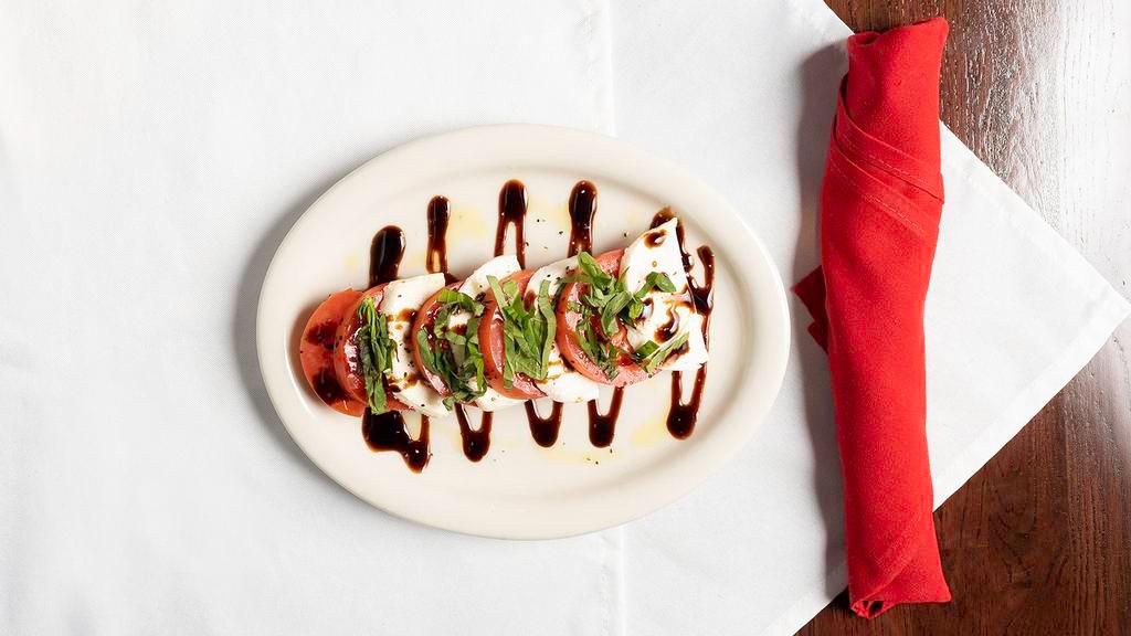Caprese · Fresh Buffalo Mozzarella, Roma Tomatoes and fresh Basil. Drizzled with extra virgin Olive Oil and Balsamic Reduction.