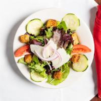 House Salad · Spring Mix salad with Roma Tomatoes, Red Onions, Cucumbers, shaved Parmesan and Croutons.